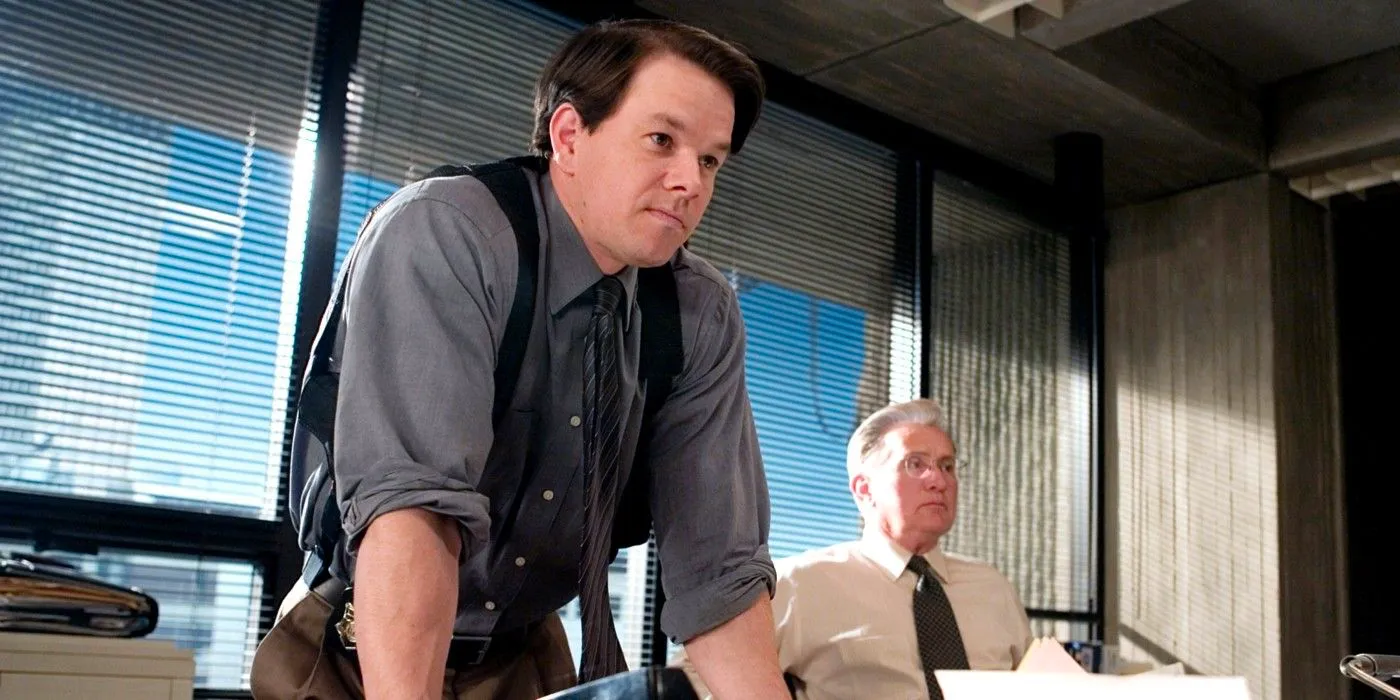 Staff Sergeant Dignam (Mark Wahlberg) leans his arms on the table at his office in The Departed Image