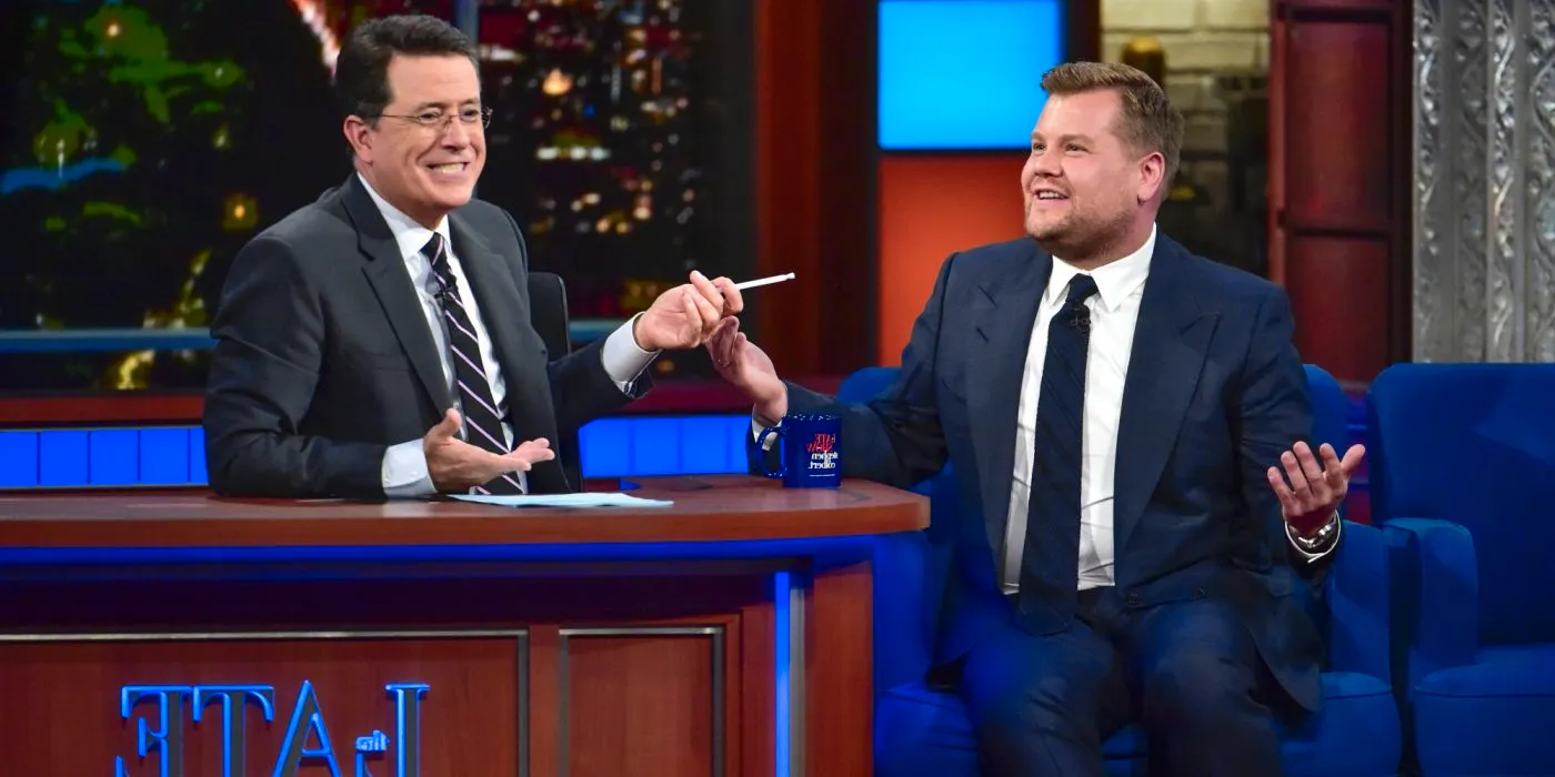 Stephen Colbert laughing with James Corden on The Late Show. Image