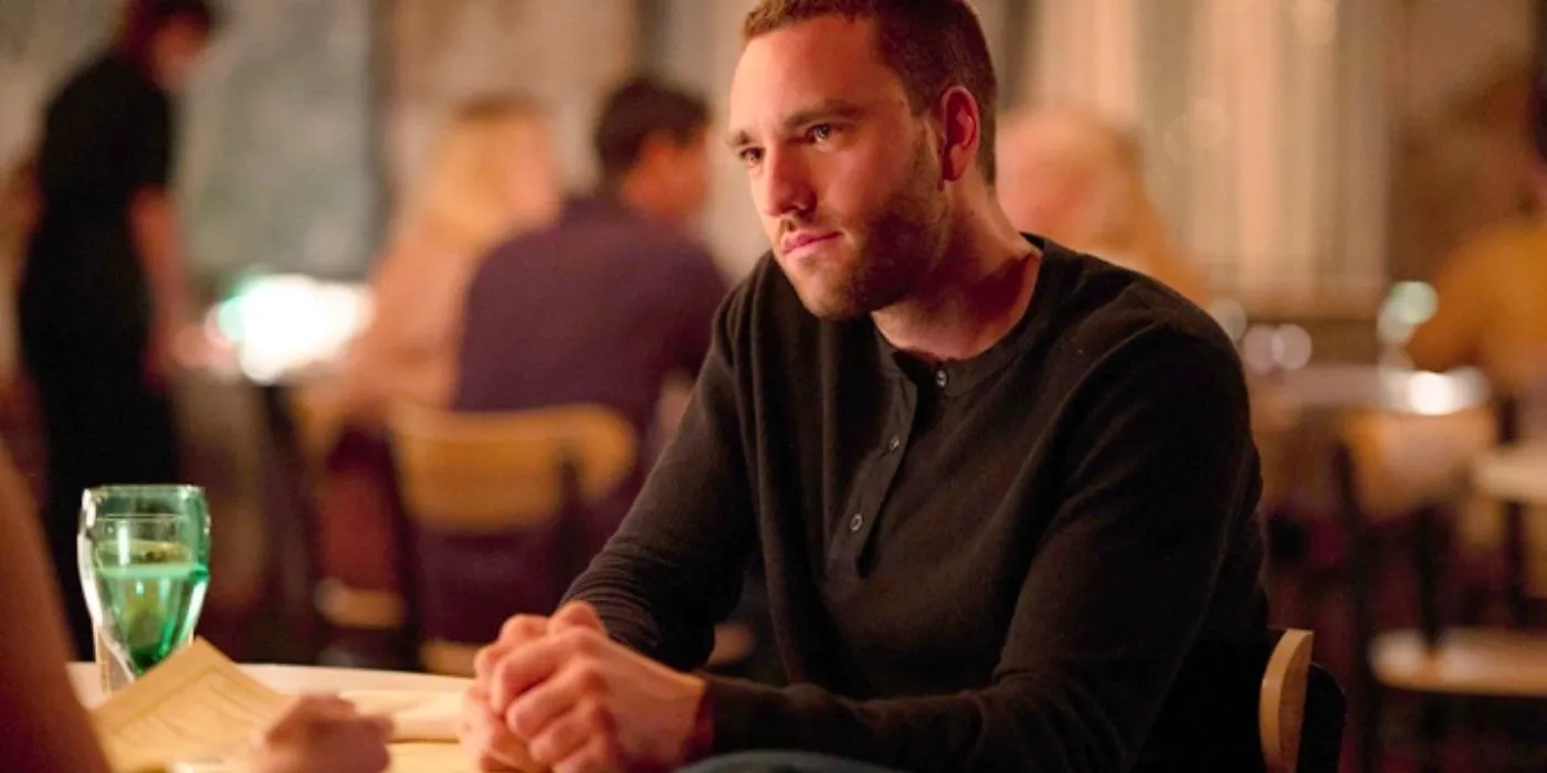 Stephen sitting at a restaurant table in Tell Me Lies Image