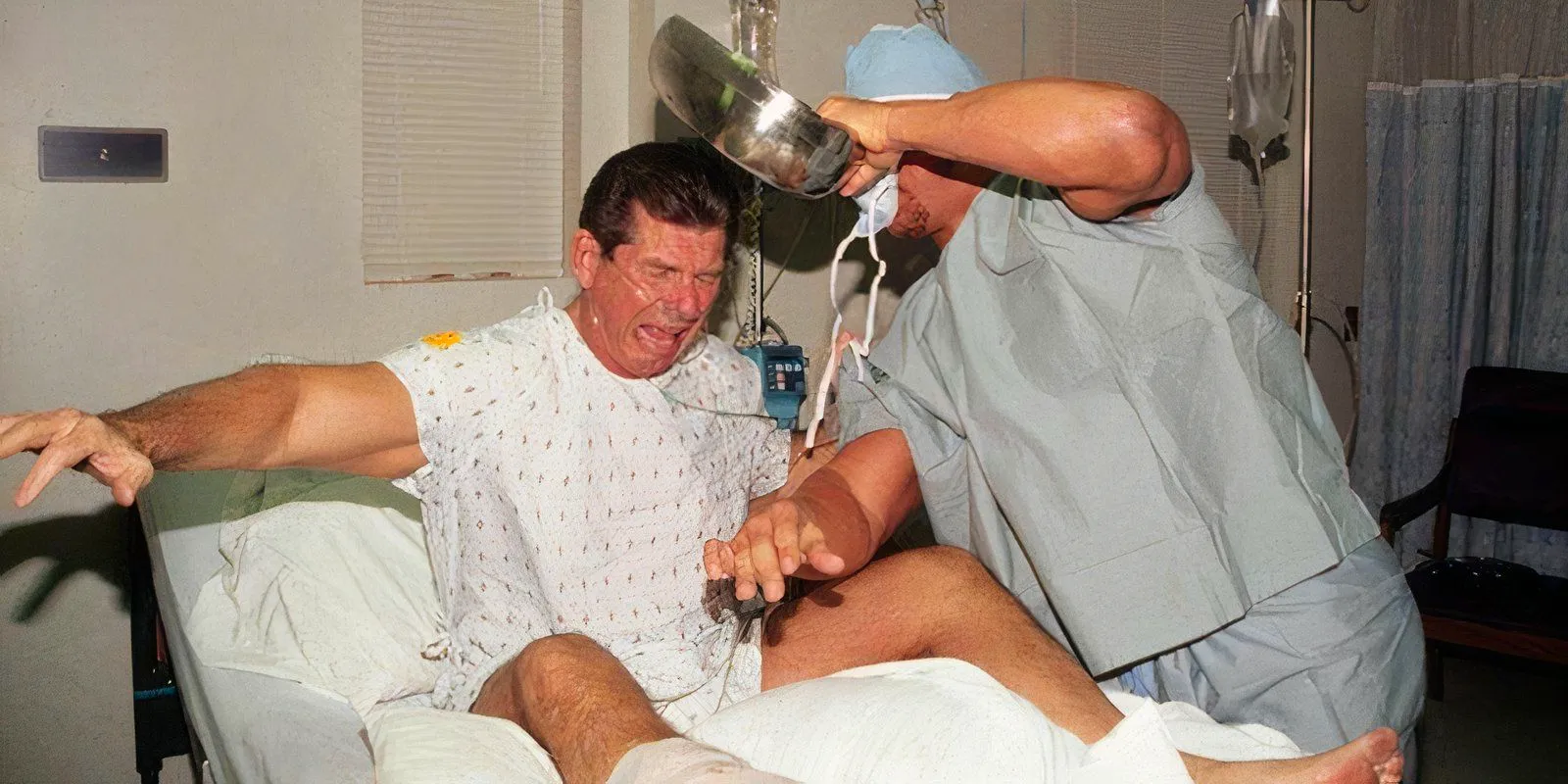 Steve Austin hits Vince McMahon with a Bedpan Image