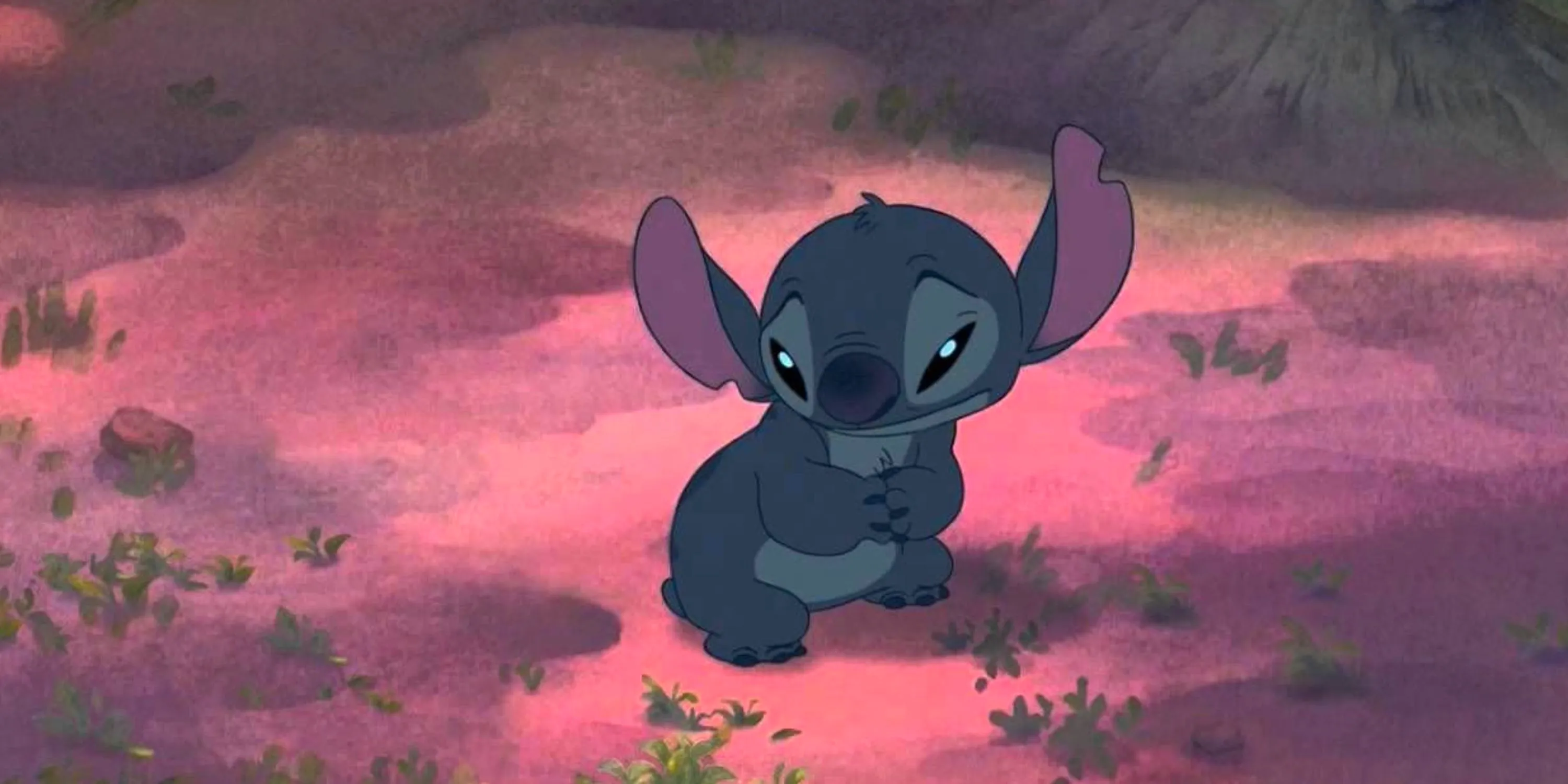 Stitch looking sad in the forest in Lilo and Stitch (2002) Image