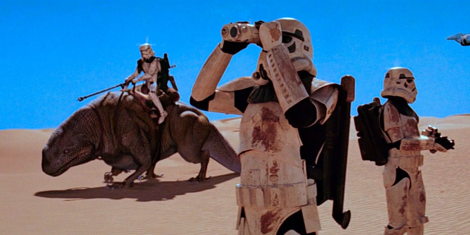 Stormtroopers canvasing the desert and riding on CGI dewbacks in Star Wars: Episode IV - A New Hope. Image