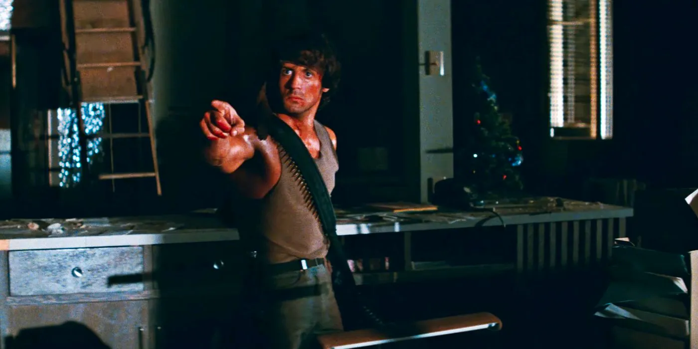 Sylvester Stallone as John Rambo pointing angrily in First Blood Image