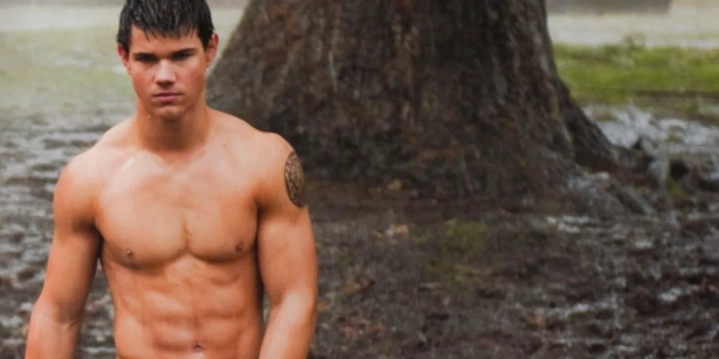 Taylor Lautner as Jacob in Twilight standing shirtless in the rain. Image