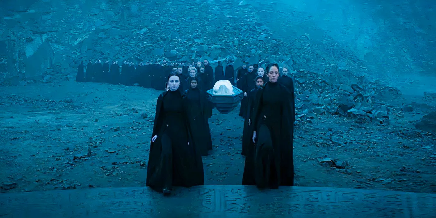 The Bene Gesserit form a line in a rocky area in Dune: Prophecy Image