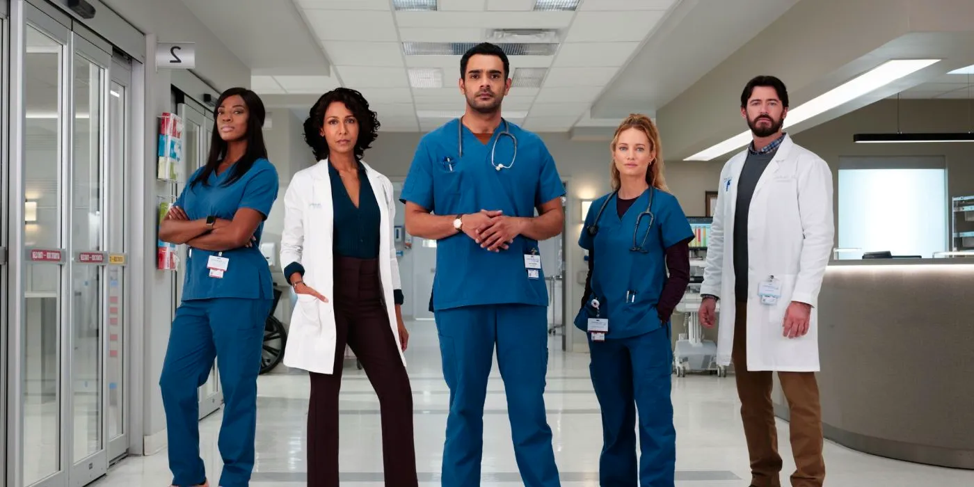 The cast of Transplant all posing together in a hospital hall. Image