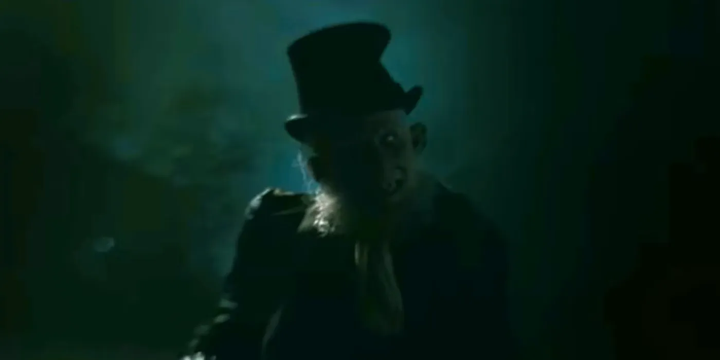 The Crooked Man in Hellboy Crooked Man wearing a top hat, looking eerily into the darkness Image