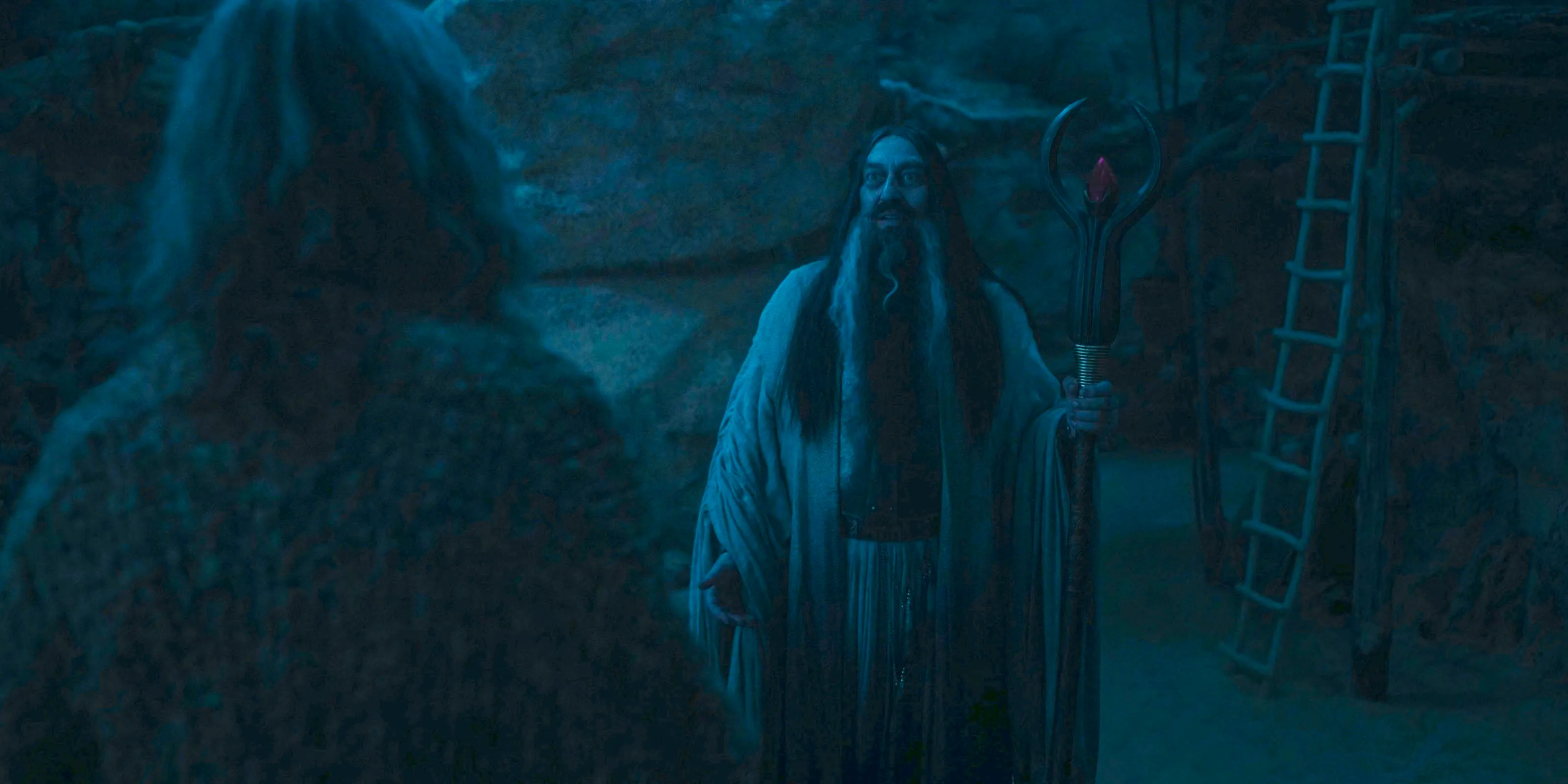 The Dark Wizard (Ciarán Hinds) encounters the Stranger in The Lord of the Rings: The Rings of Power Season 2 Episode 8 Image