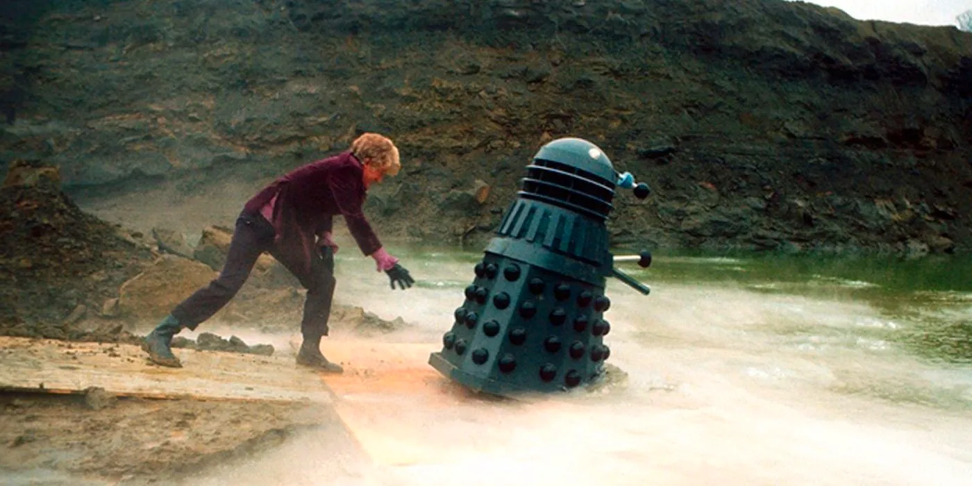 The Doctor Pushes a Dalek into the Water in Doctor Who Image