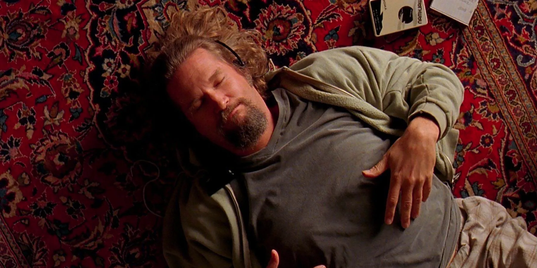 The Dude lying on a rug in The Big Lebowski Image