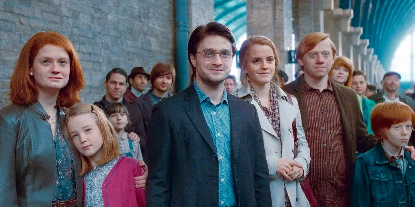 The epilogue of Harry Potter and the Deathly Hallows: Part 2 features Harry, Ginny, Ron, and Hermione with their kids smiling and watching the Hogwarts Express leave the station Image