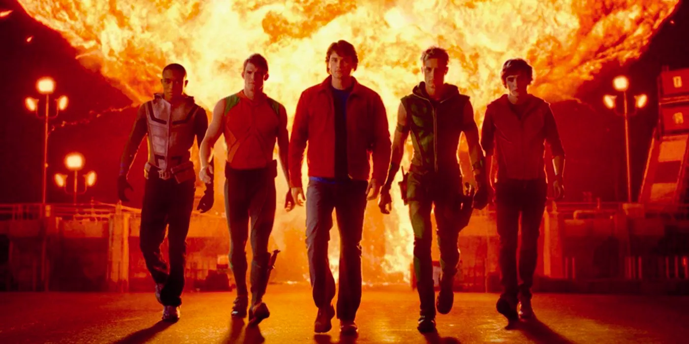 The Justice League walking away from an explosion in Smallville. Image