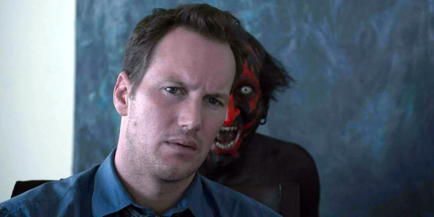 The lipstick demon peaks out from behind Patrick Wilson in Insidious Image