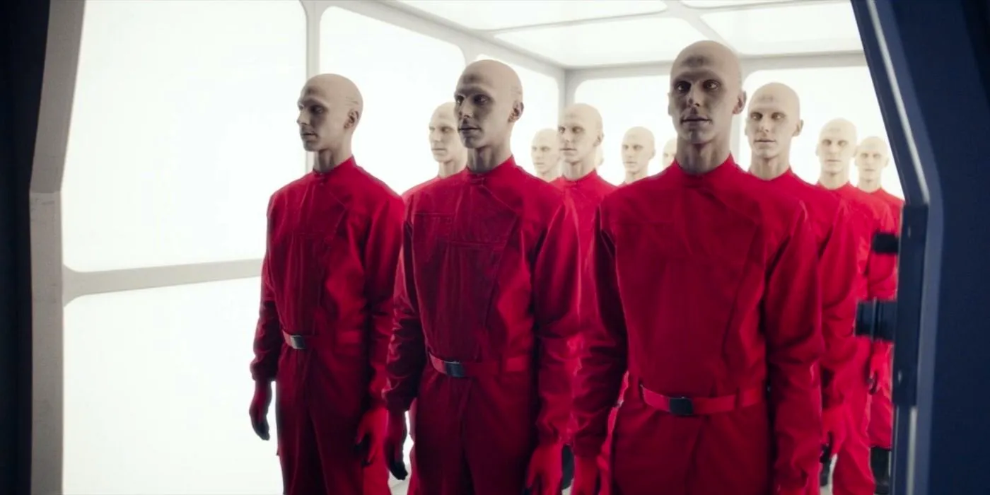 The Mars Synths stand together in red jumpsuits with no expressions in the Star Trek: Picard episode 