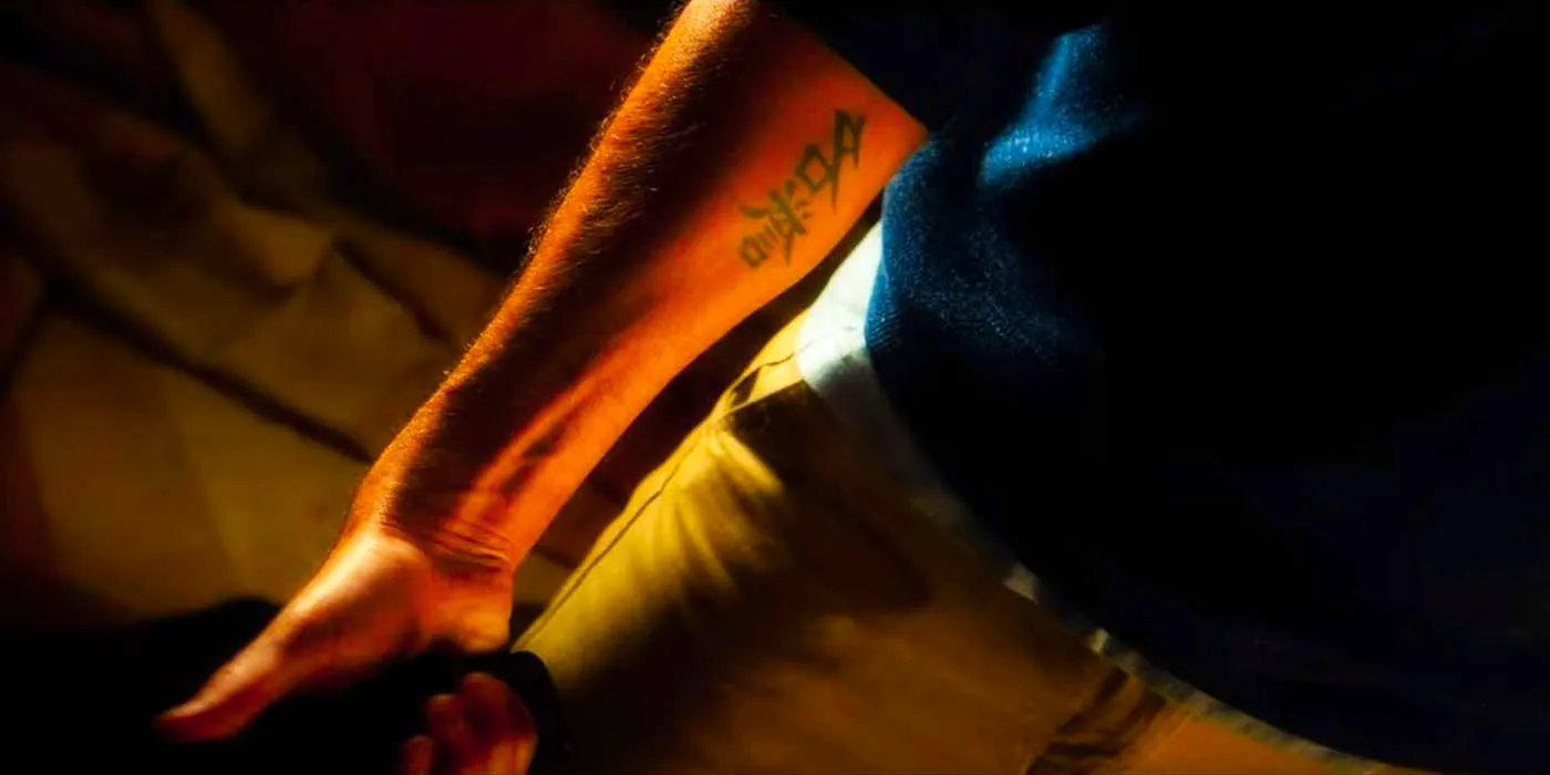 The mysterious Tattoo Man's arm in The Lincoln Lawyer Image