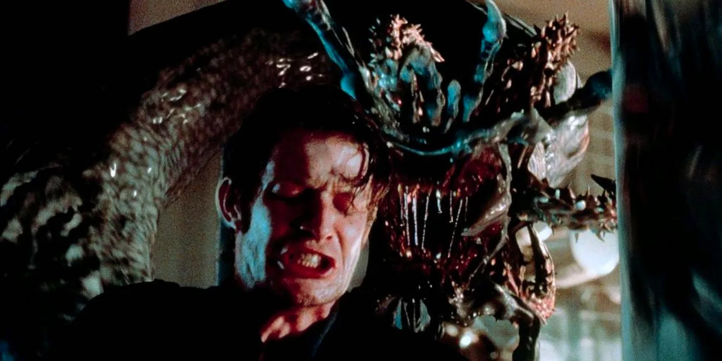 The sea monster sneaking up on a victim in Deep Rising Image