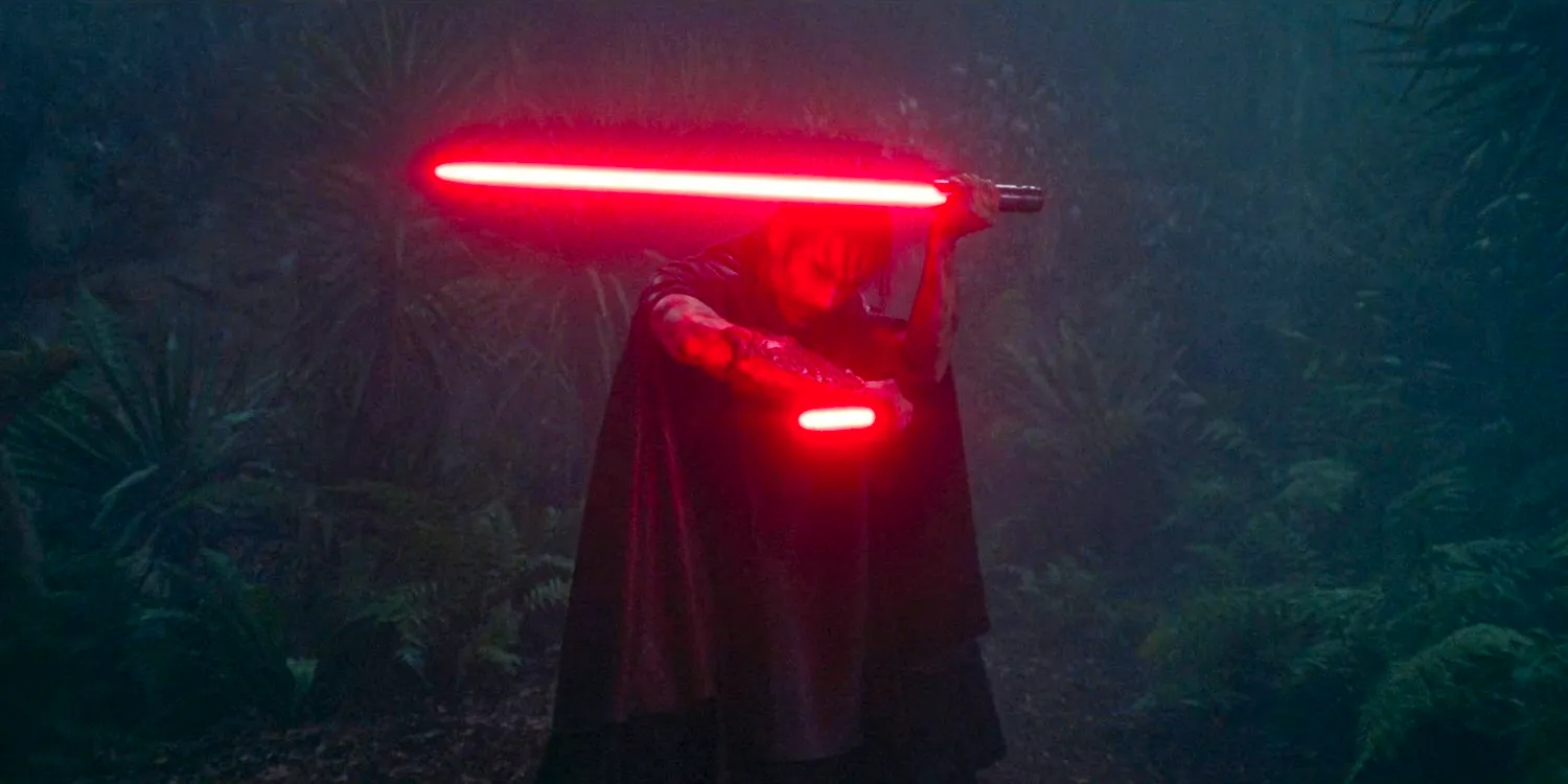 The Sith's identity is revealed, Qimir (Manny Jacinto) holding a pair of lightsabers in The Acolyte season 1 episode 5 Image