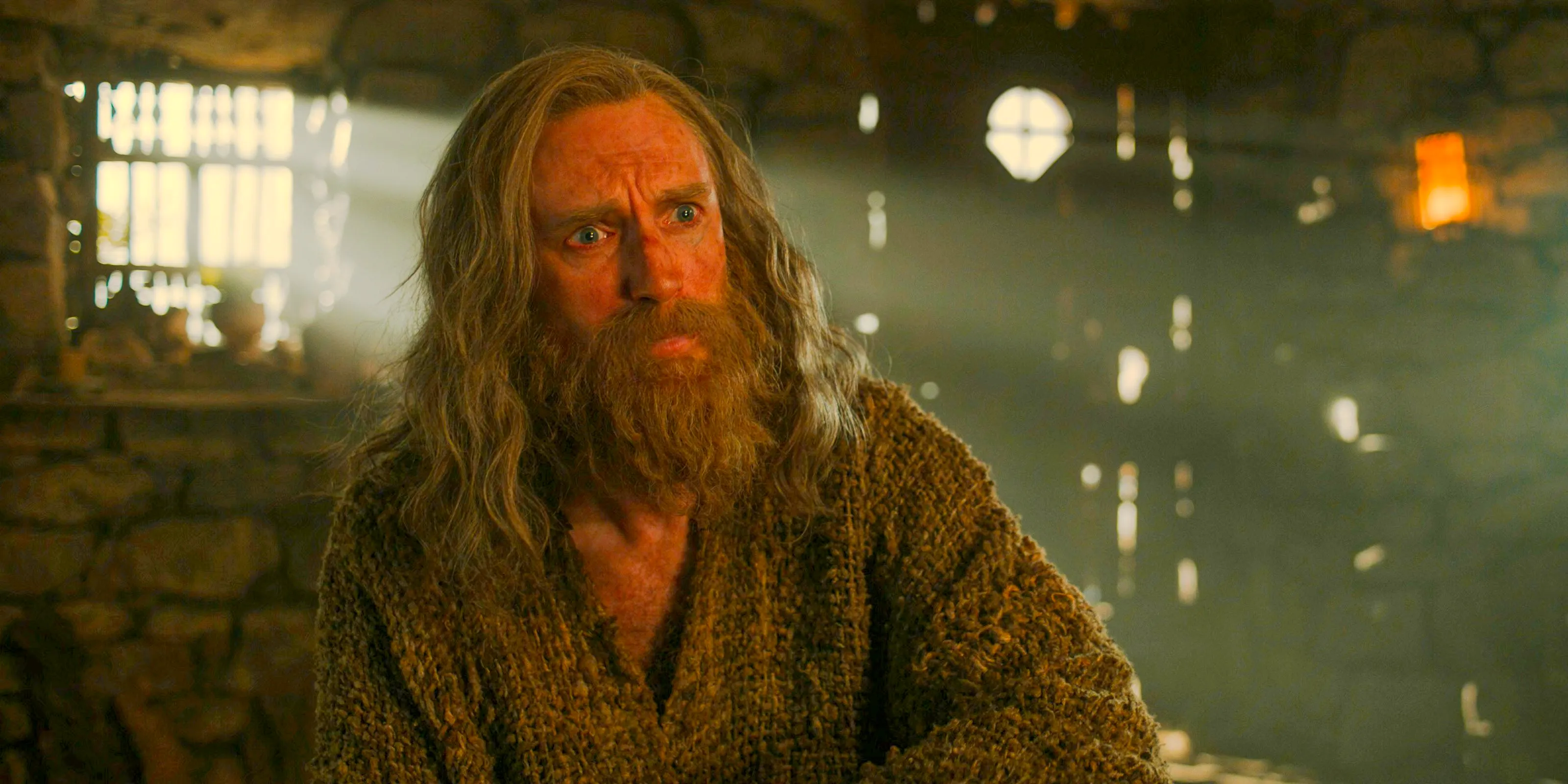 The Stranger (Daniel Weyman) looking shocked in The Lord of the Rings: The Rings of Power Season 2 Episode 6 Image