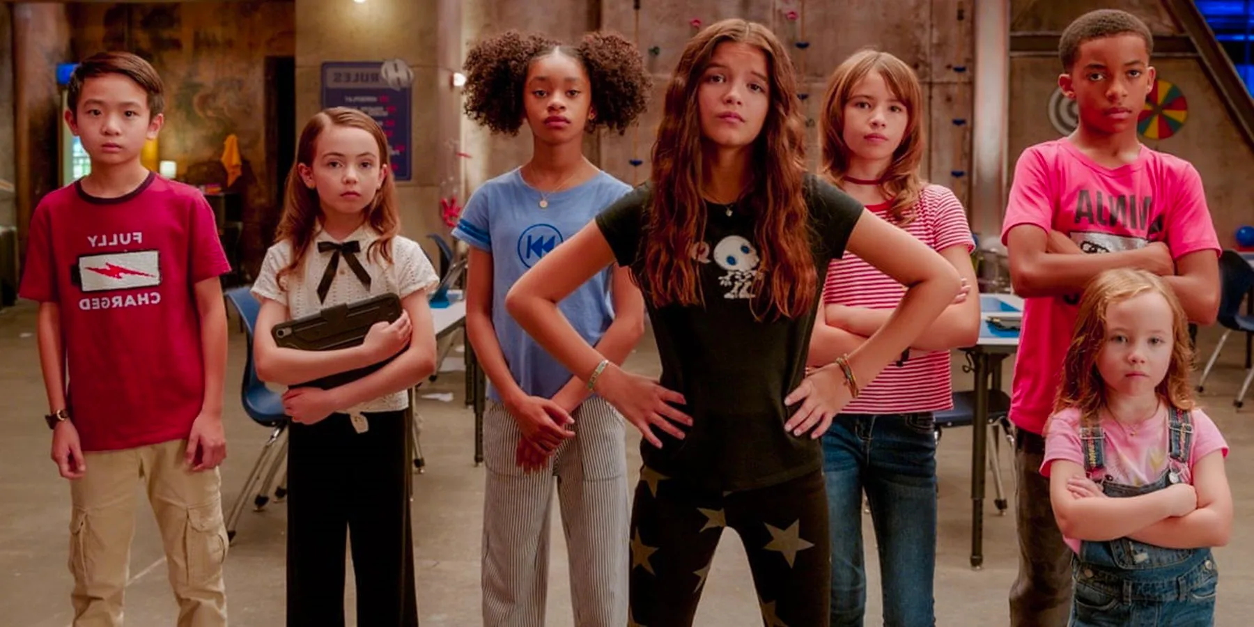 The superpowered kids looking off-screen in We Can Be Heroes Image