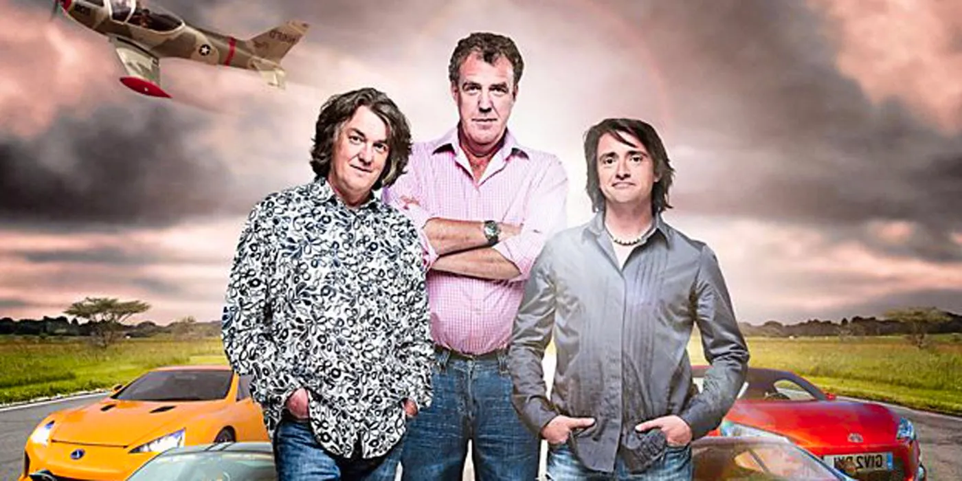 The Top Gear crew in front of cars. Image