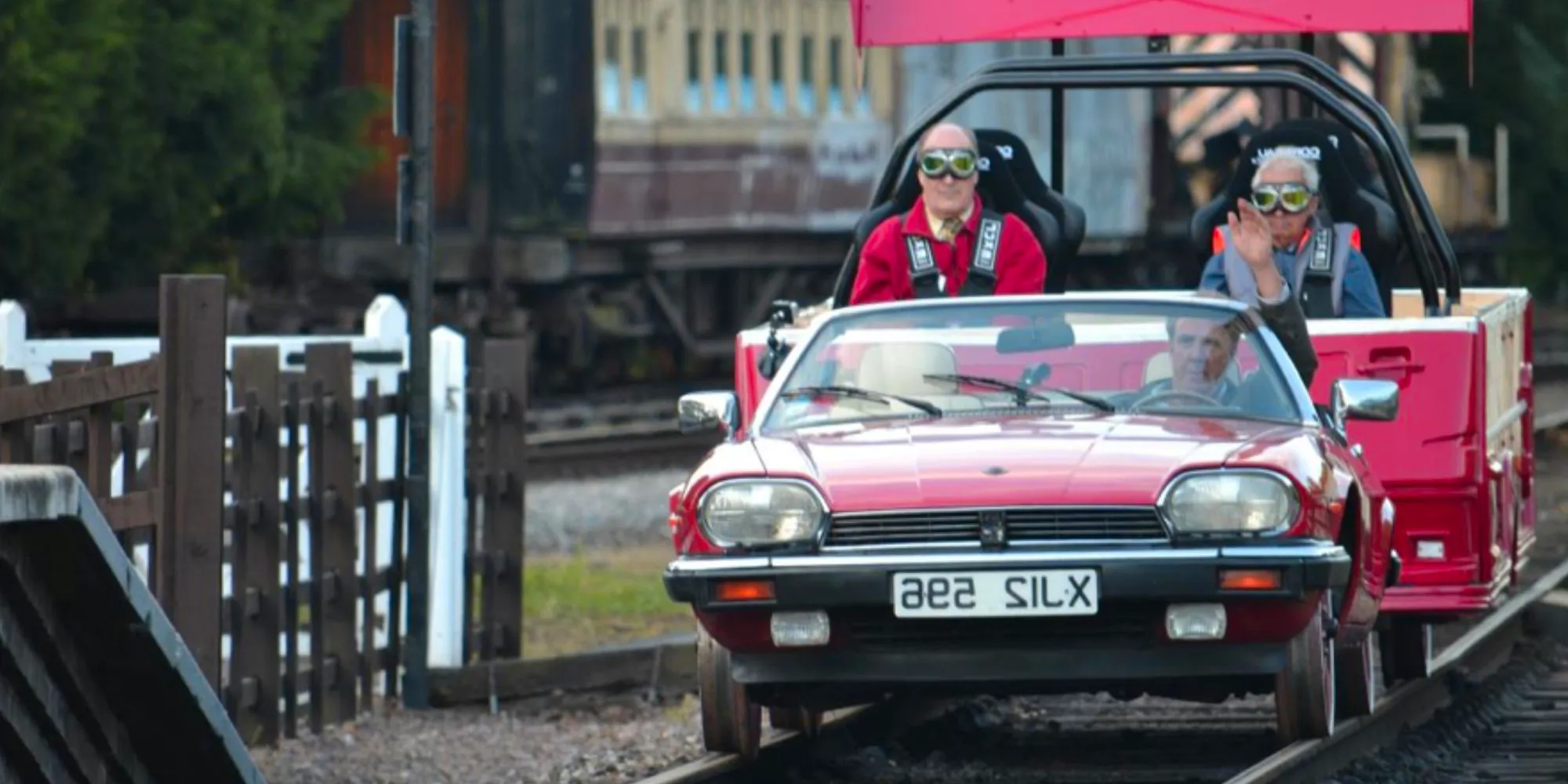 The trio makes modified trains in Top Gear Season 17 Episode 4 in red car with three cast members Image