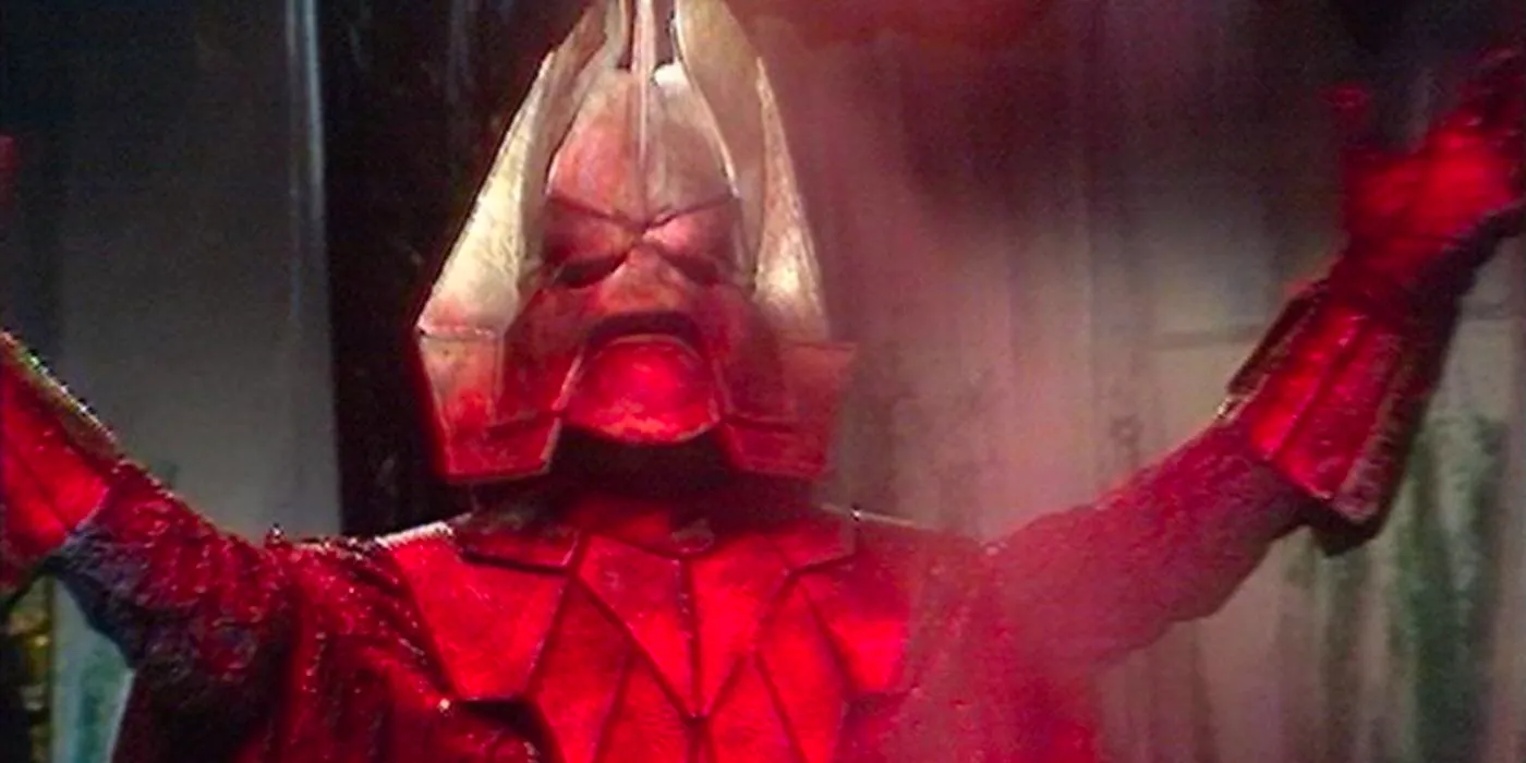 The villain Omega surrounded by red smoke in Doctor Who Image