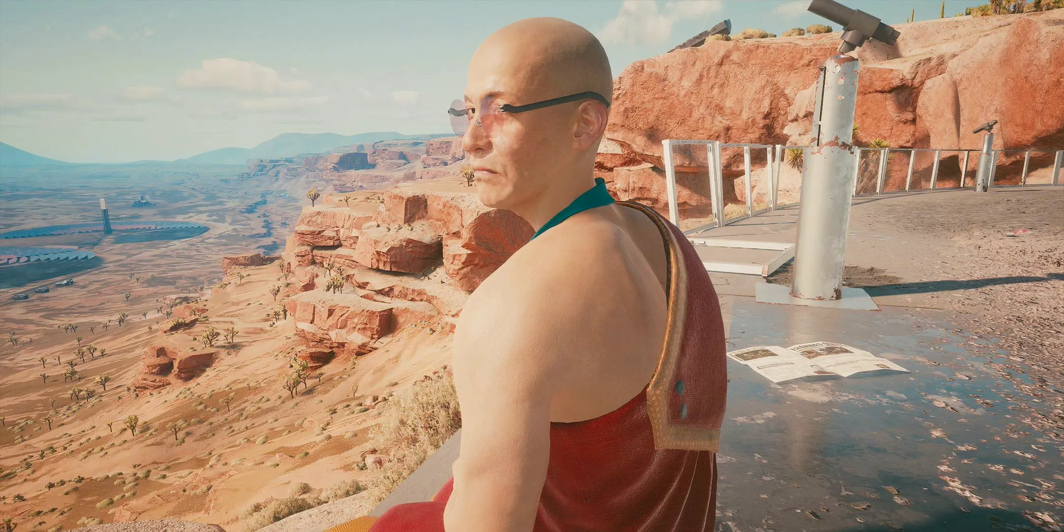 The Zen Master in Cyberpunk 2077 sat down in the badlands with the desert stretching out behind him. Image