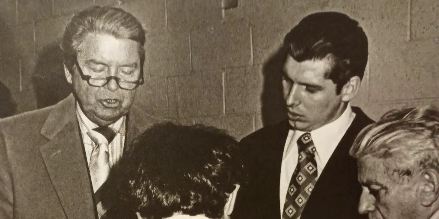 throwback photo of Vince McMahon Sr. and Mr. McMahon talking backstage Image