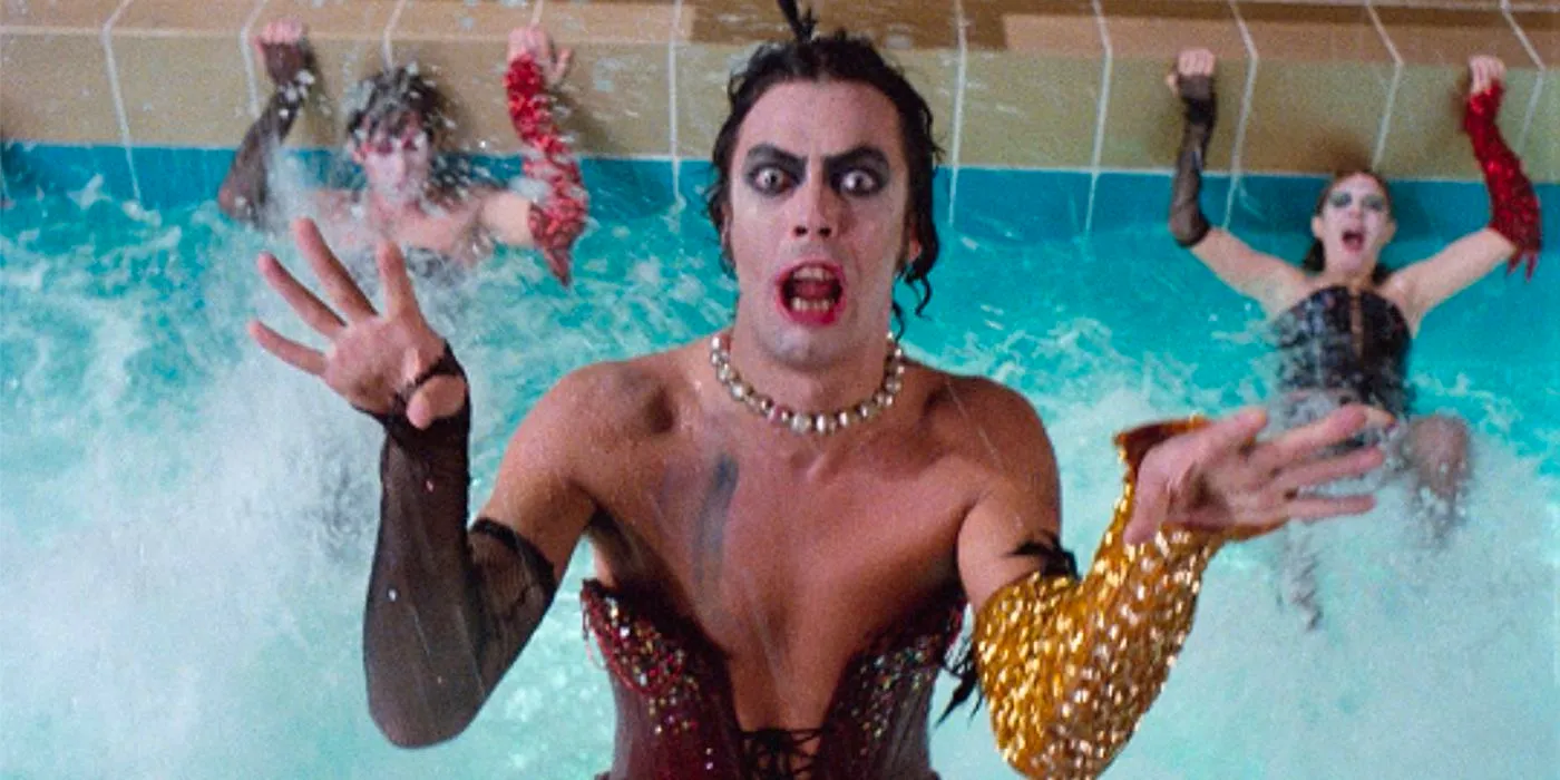 Tim Curry as Dr. Frank-N-Furter in a pool wearing a maroon corset in Rocky Horror Picture Show Image