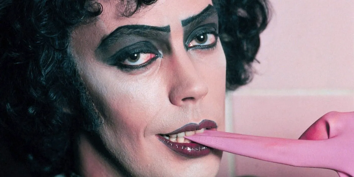 Tim Curry biting his glove in the Rocky Horror Picture Show Image