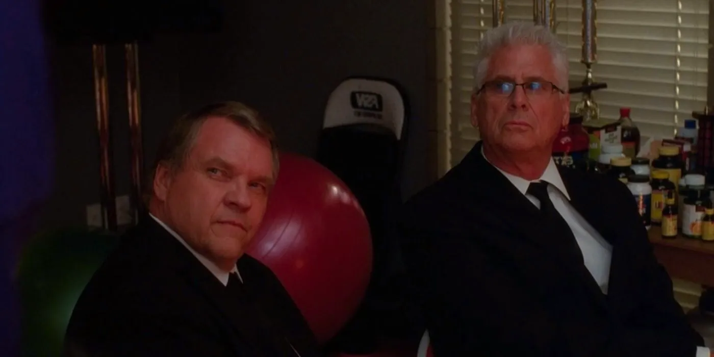 Tim Stanwick (Barry Bostwick) and Barry Jeffries (Meat Loaf) looking at someone on Glee Image