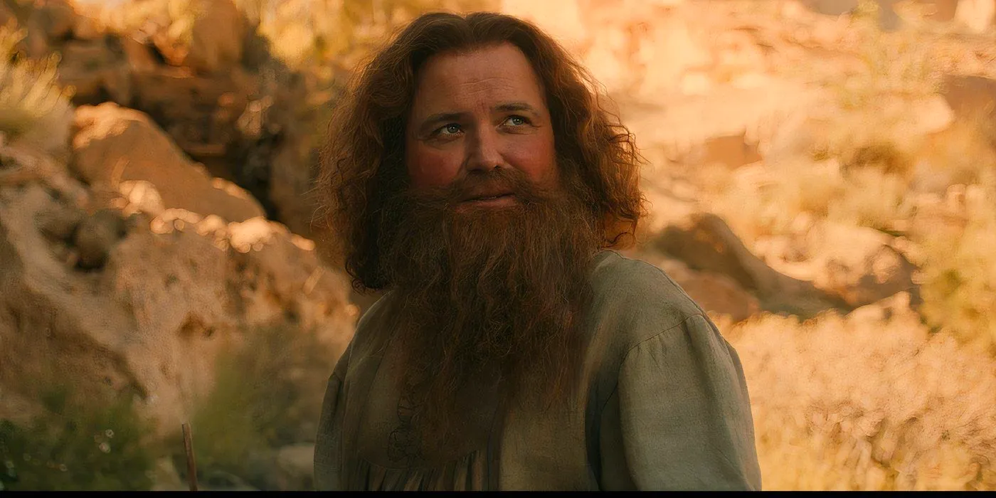 Tom Bombadil smiling at the Stranger in Rings of Power (2024) Image