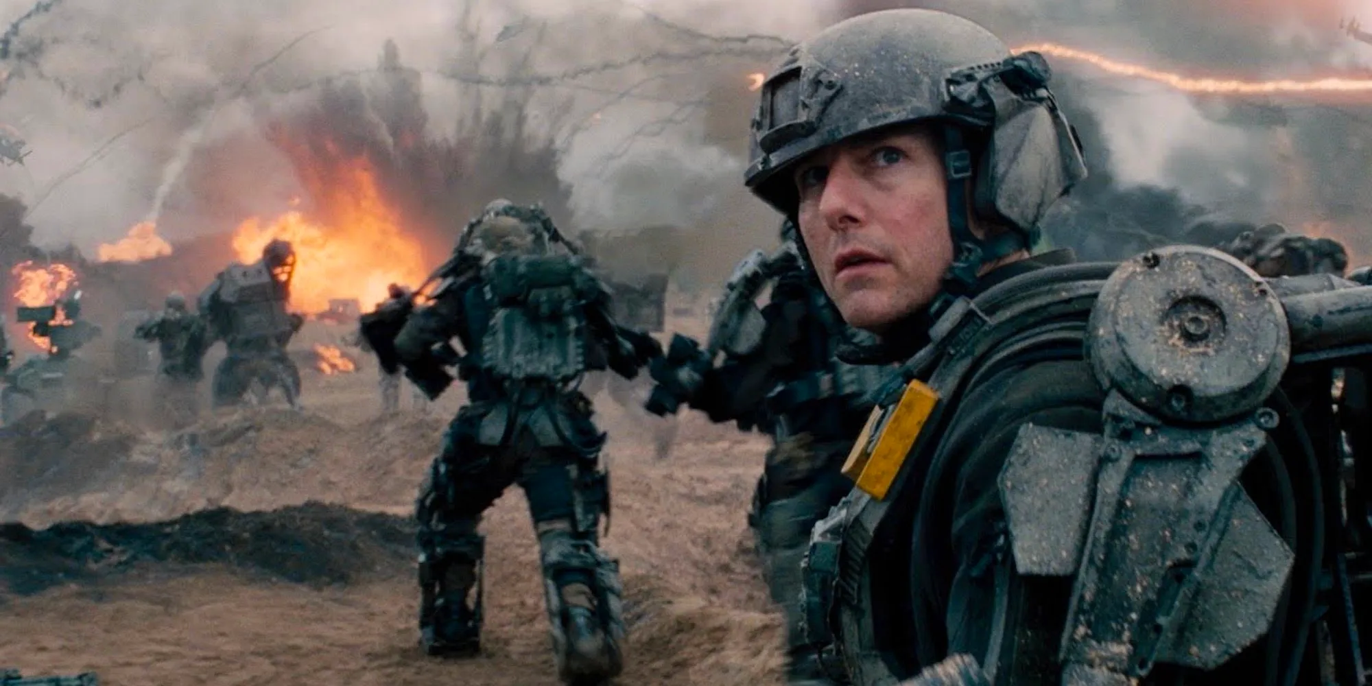 Tom Cruise looking back on a battlefield in the Edge of Tomorrow trailer. Image