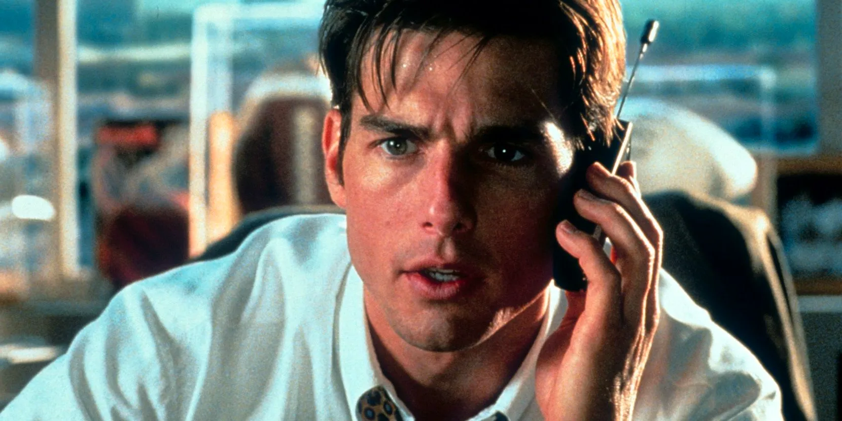 Tom Cruise on the phone in Jerry Maguire Image