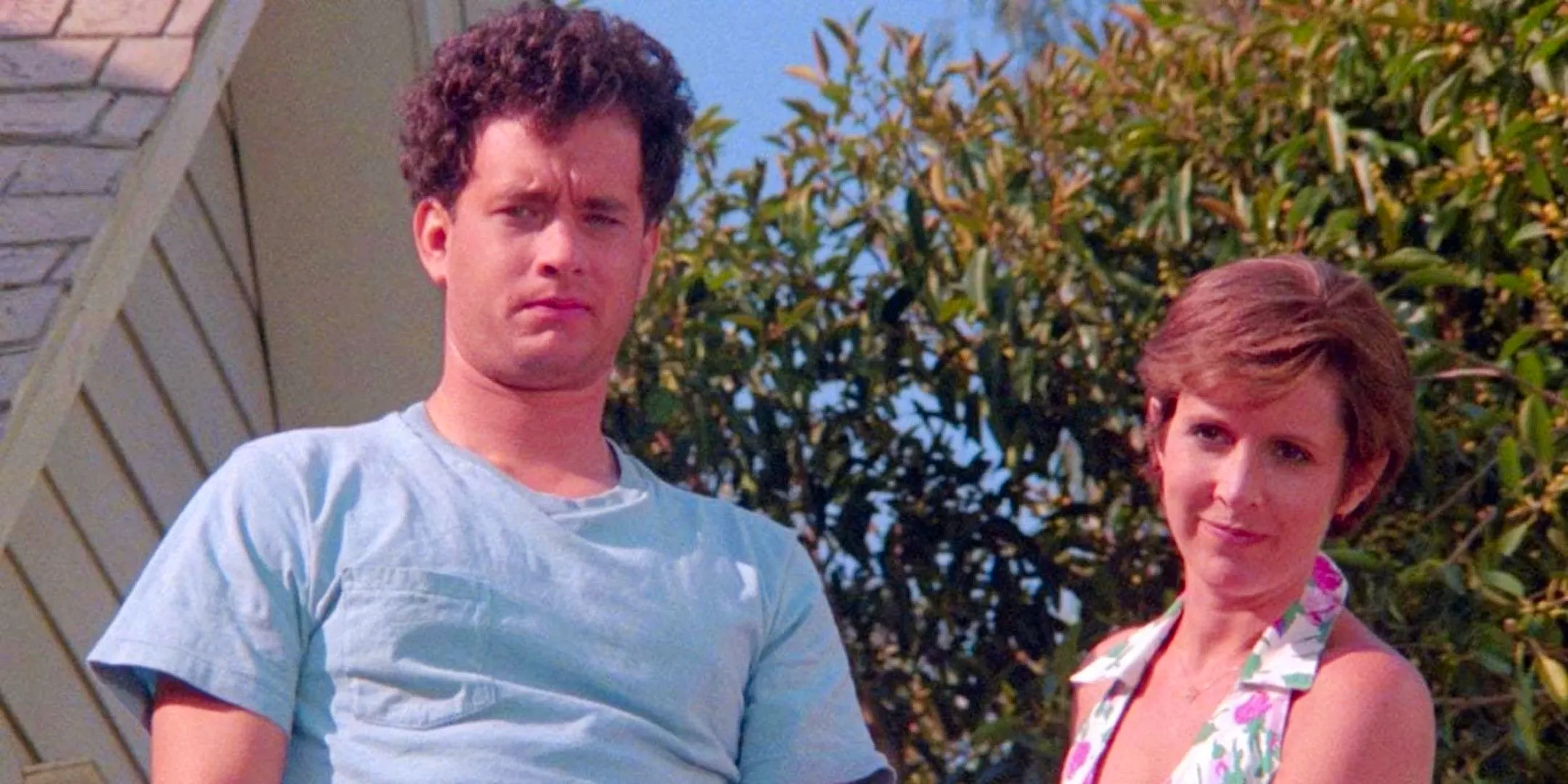 Tom Hanks and Carrie Fisher look out over street in The 'Burbs Image