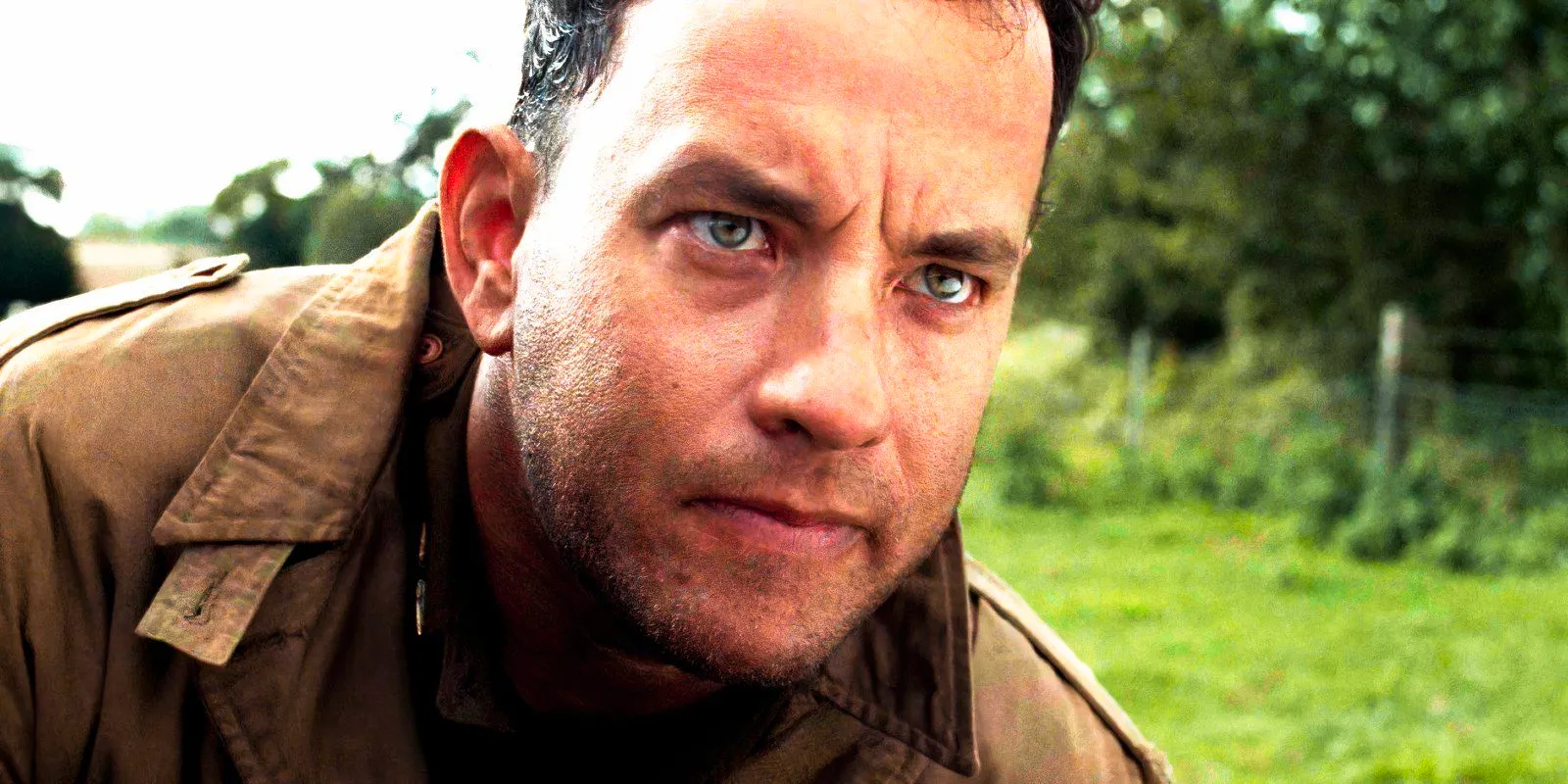 Tom Hanks looking serious as Captain Miller in Saving Private Ryan Image