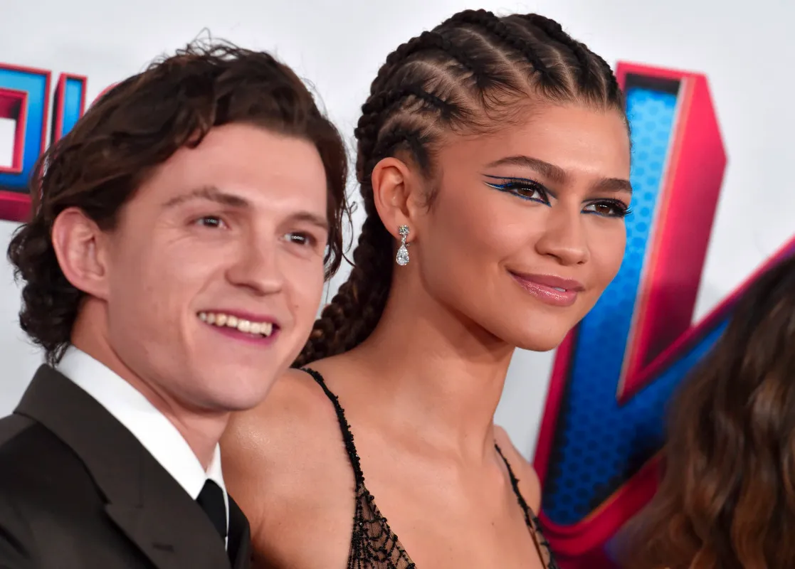 Tom Holland Literally Throws Hands to Rescue Zendaya From Aggressive Paparazzi Image