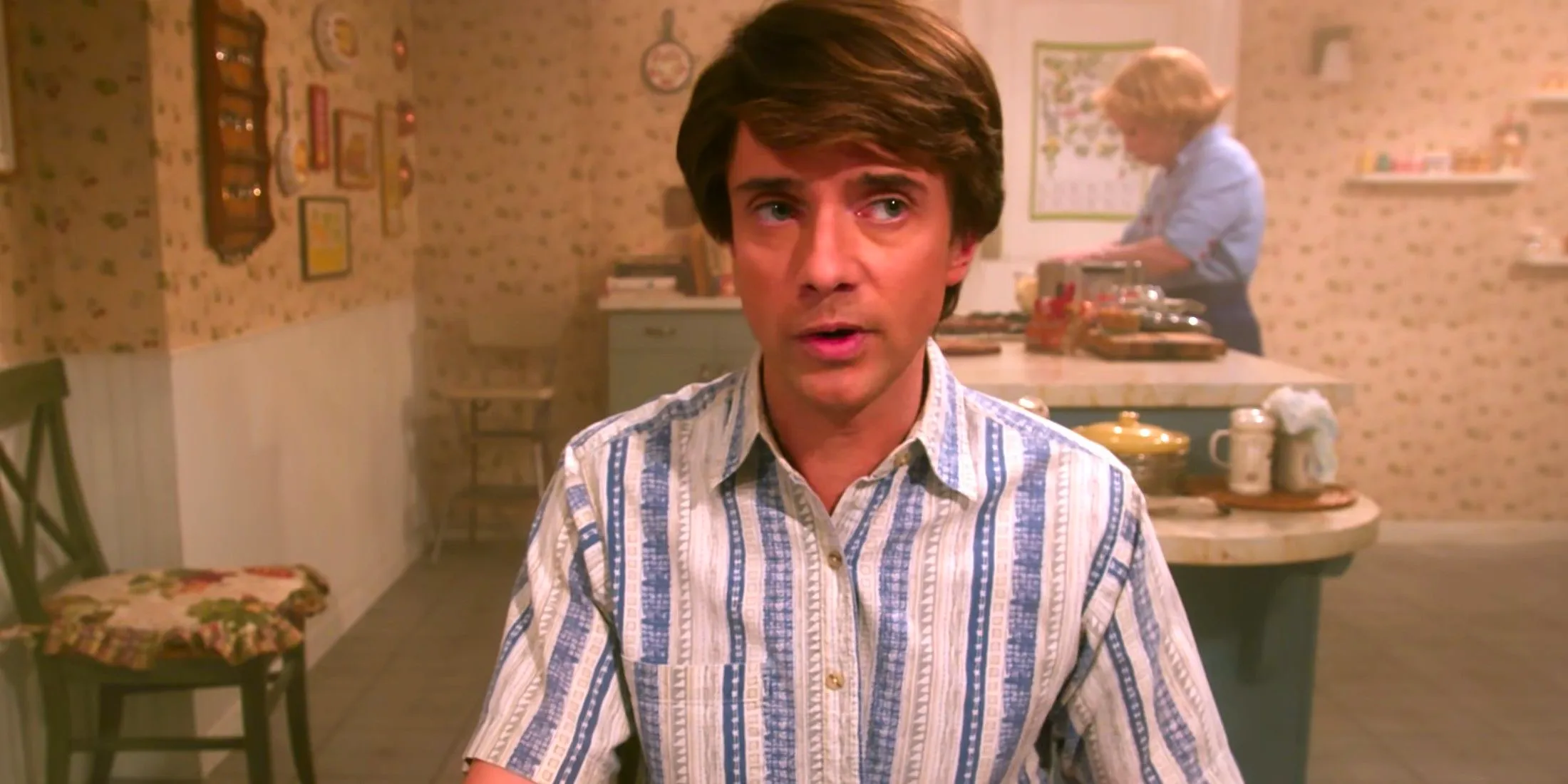 Topher Grace as Eric Forman in That '90s Show with Kitty in the background in the kitchen Image