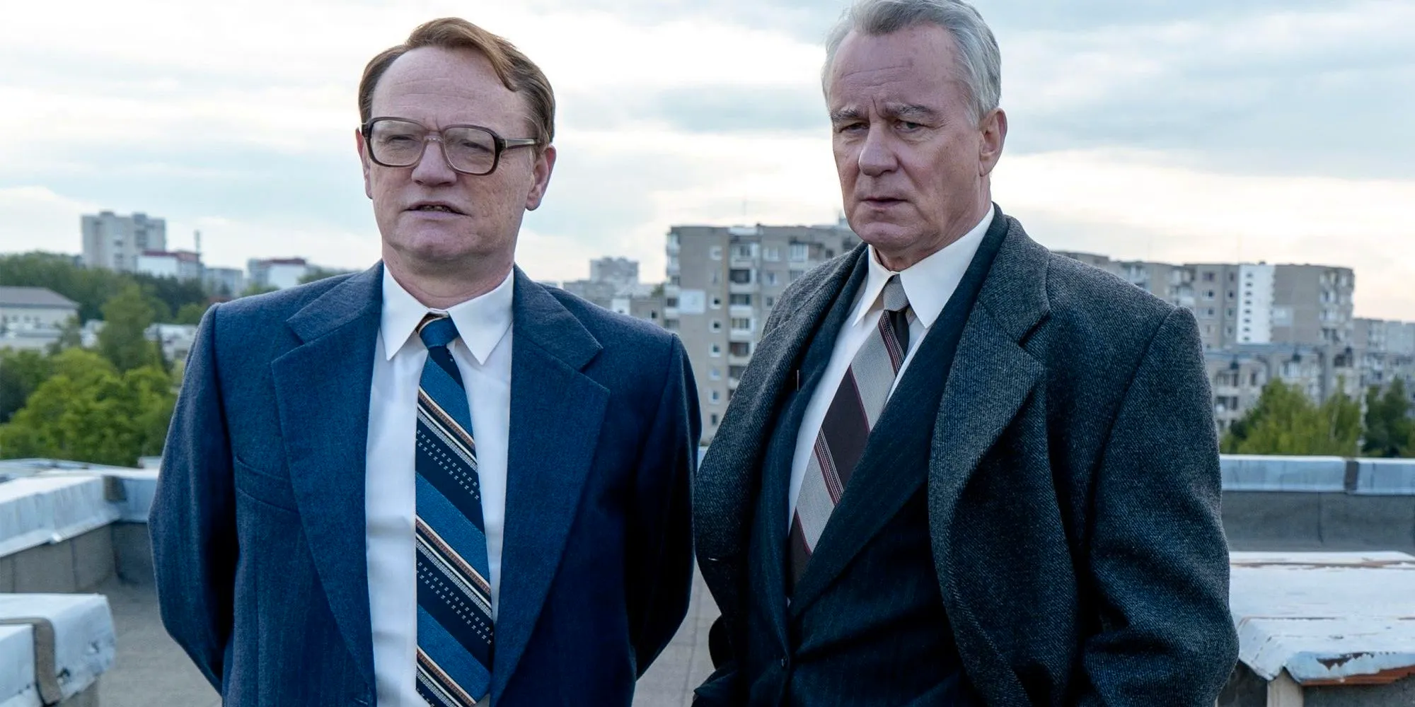 Two men stand on a roof in Chernobyl  Image