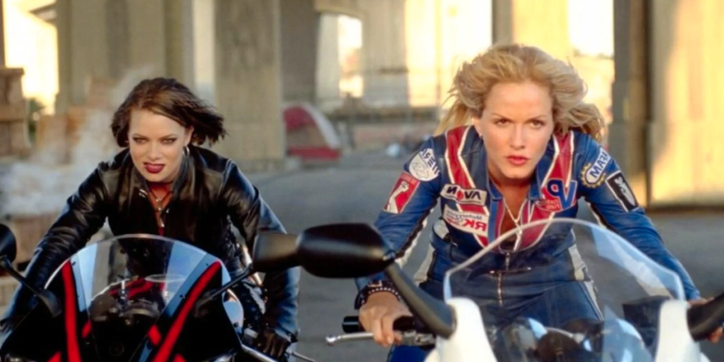 Two women on motorcycles next to each other in Torque Image