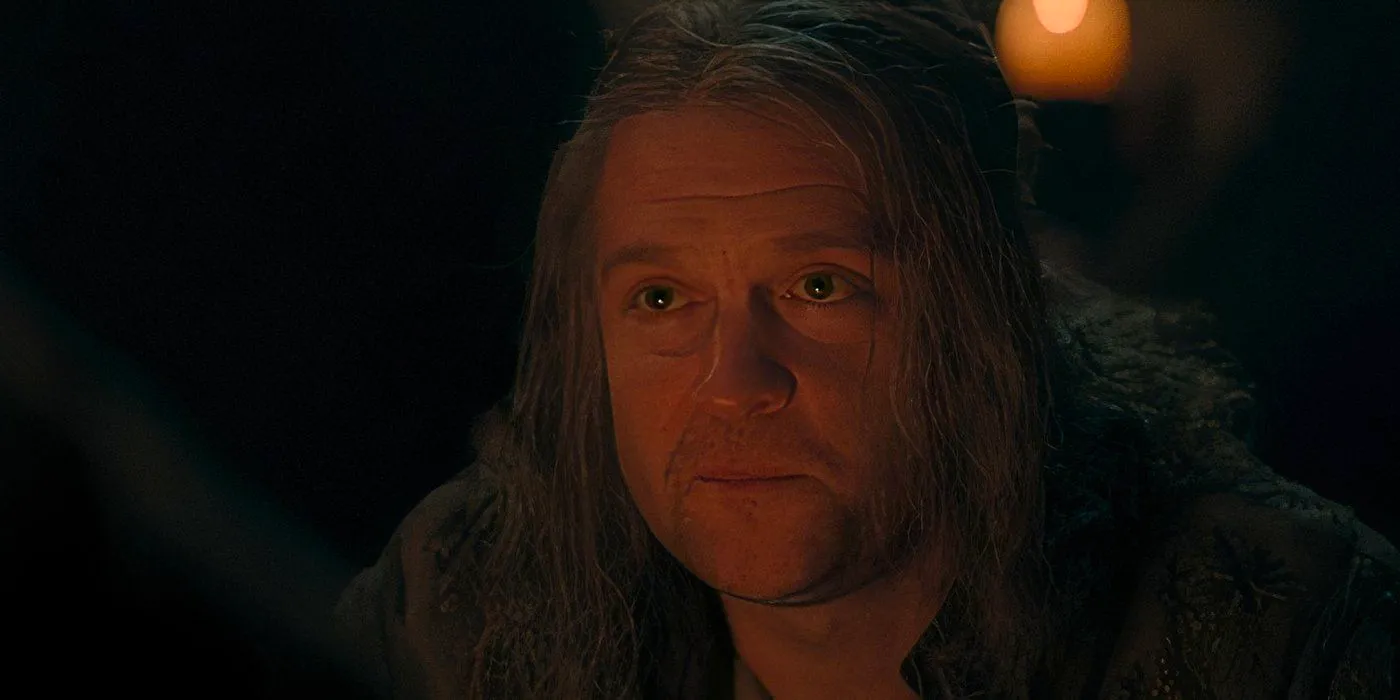 Ulf (Tom Bennett) lit by firelight staring ahead in House of the Dragon season 2, episode 3 Image