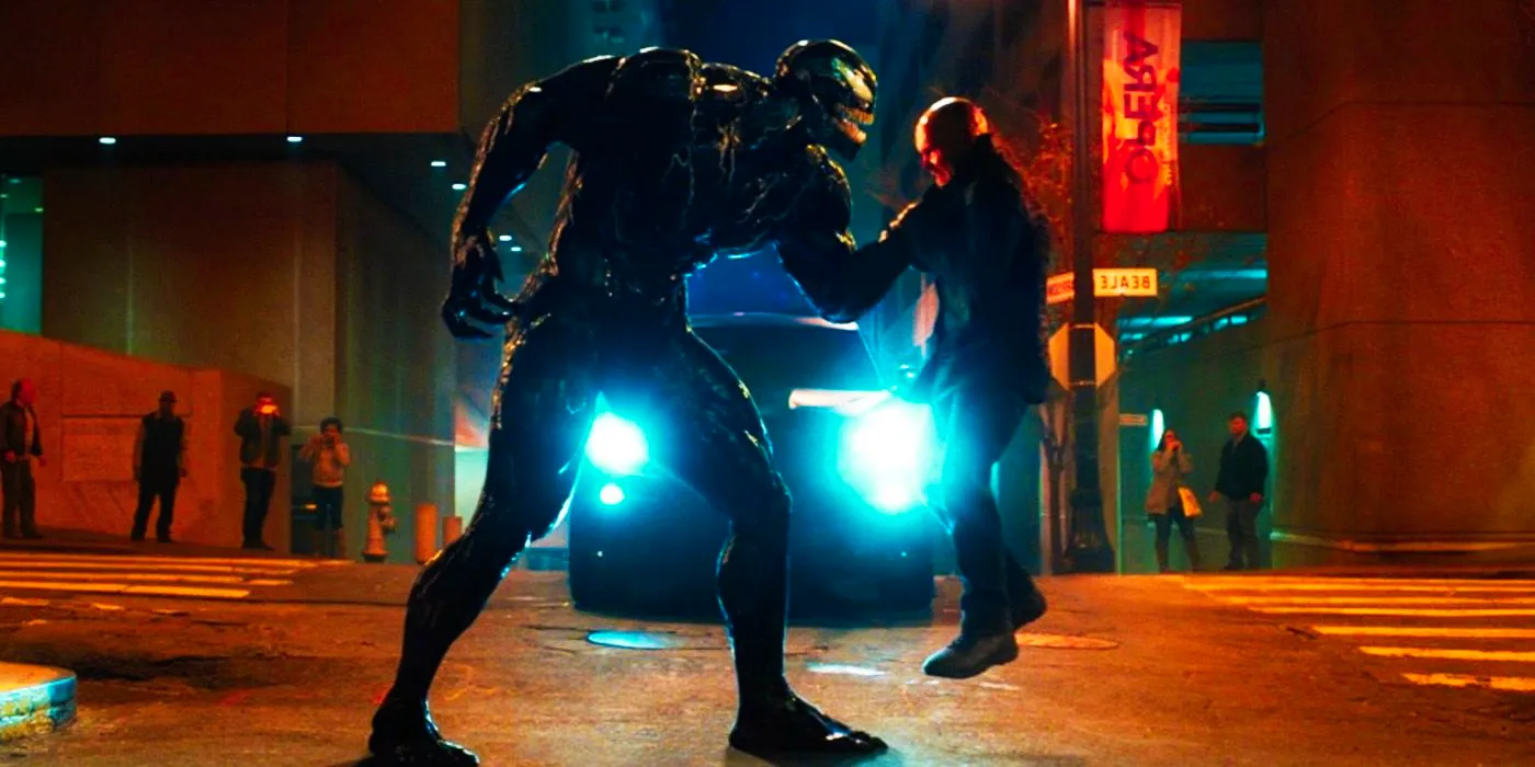 Venom picking someone up in the street in 2018's Venom Image