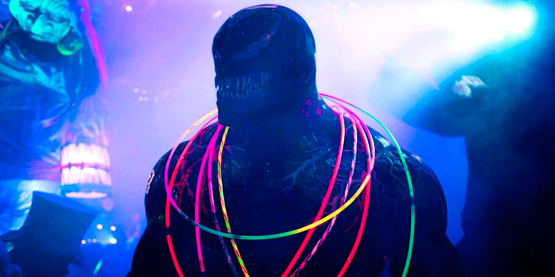 Venom With Glowstick Necklaces In A Club In Venom Let There Be Carnage Image