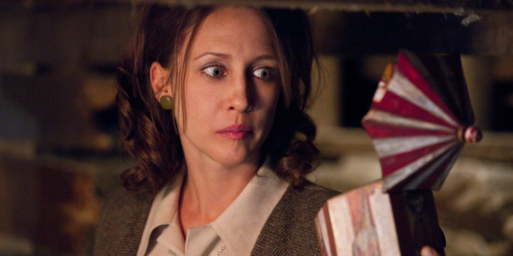 Vera Farmiga as Lorraine Warren holding music box in The Conjuring Image