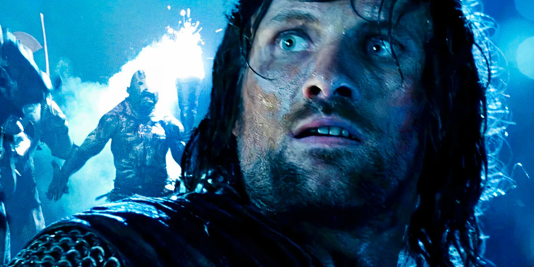 Viggo Mortensen as Aragorn juxtaposed with a charging Uruk-hai in The Lord of the Rings The Two Towers Image