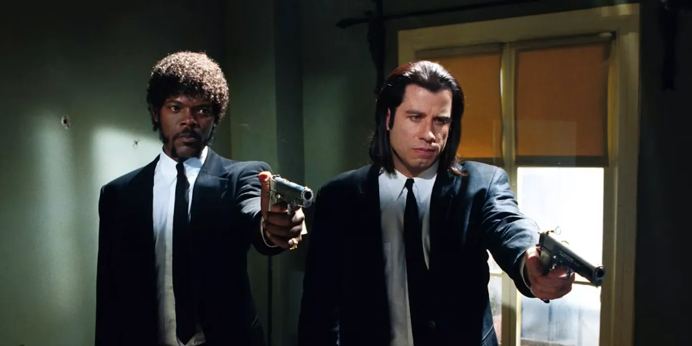 Vincent and Jules pointing guns in Pulp Fiction Image