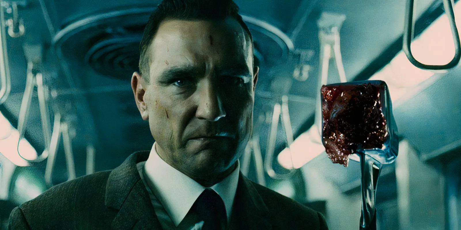 Vinnie Jones holding a bloody hammer as Mahogany in The Midnight Meat Train Image