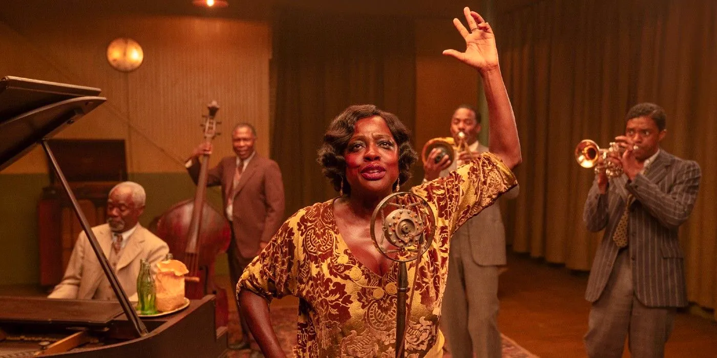 Viola Davis raising a hand in front of the mic while the band plays in Ma Rainey's Black Bottom Netflix Image