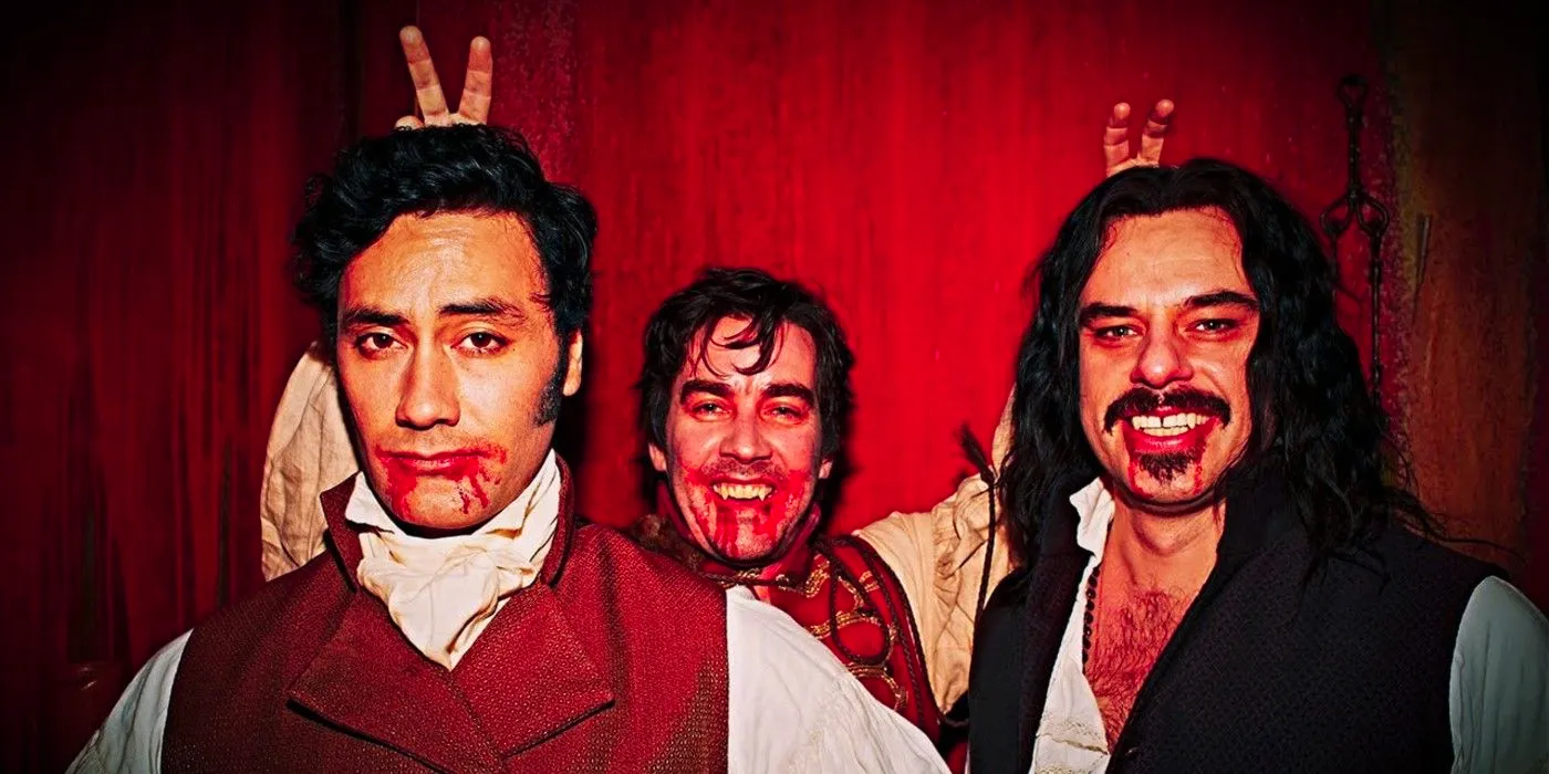 Vlad, Deacon and Viago posing for a picture with blood down the sides of their mouths in What We Do in the Shadows Image