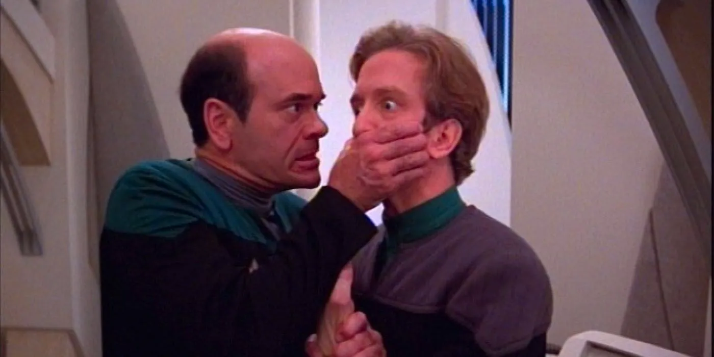 Voyager's Doctor comedically covers the mouth of Andy Dick's EMH Mark 2 in the Star Trek: Voyager episode 